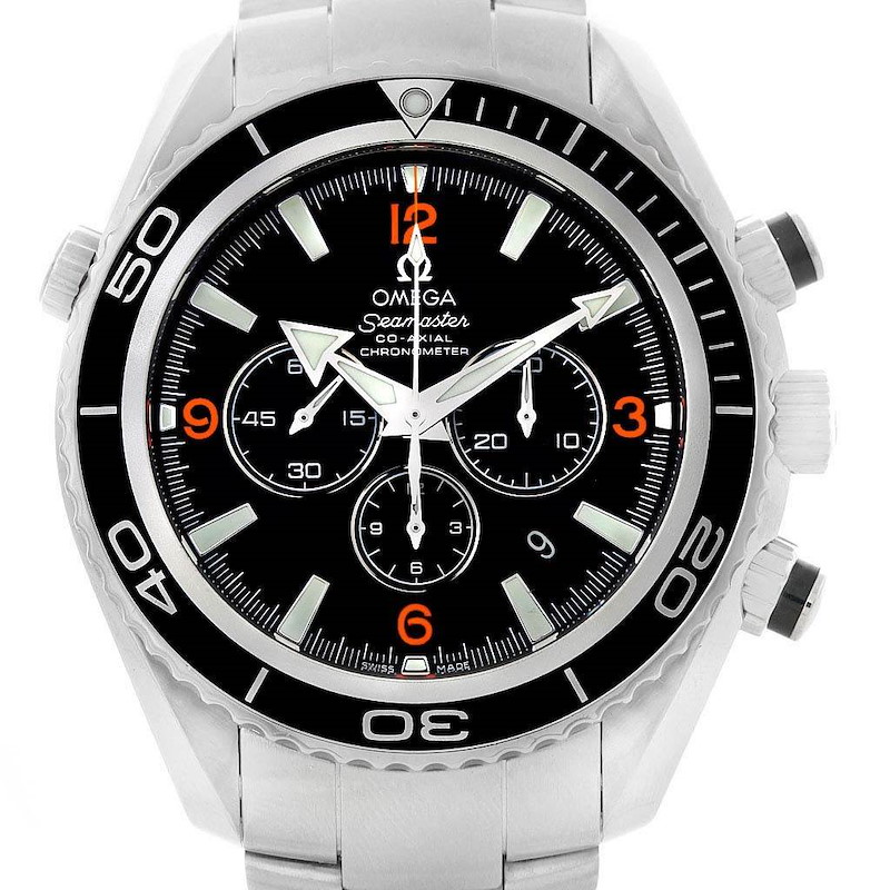 The image shows a frontal view of the Omega Planet Ocean Seamaster watch, showing the dial, hands, bezel, and chronograph sub-dials.