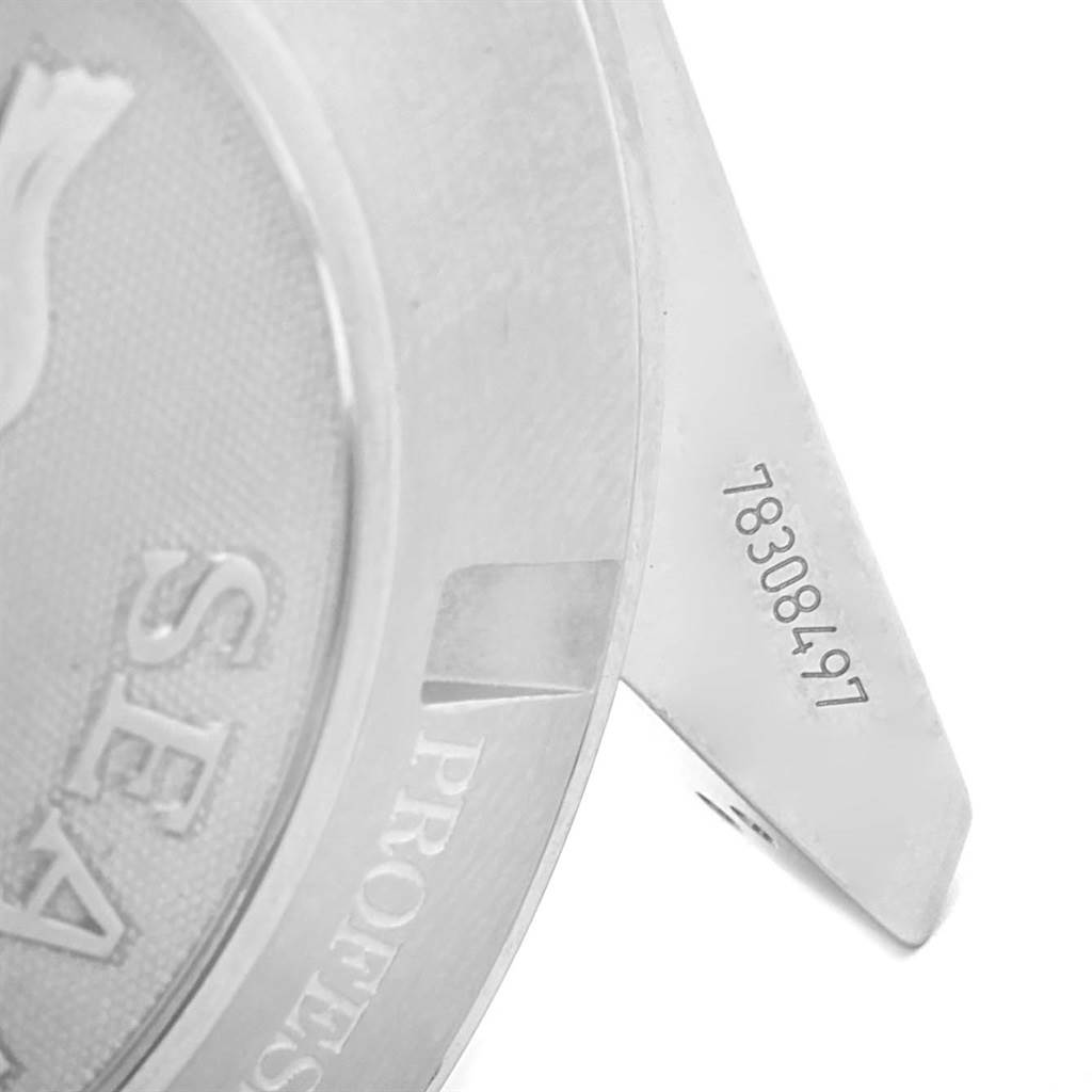 The image shows a macro shot of the case back and serial number of an Omega Planet Ocean 2210.51.00 Men's Stainless Steel Black Dial 2210.51.00 Men's Stainless Steel Black Dial watch.