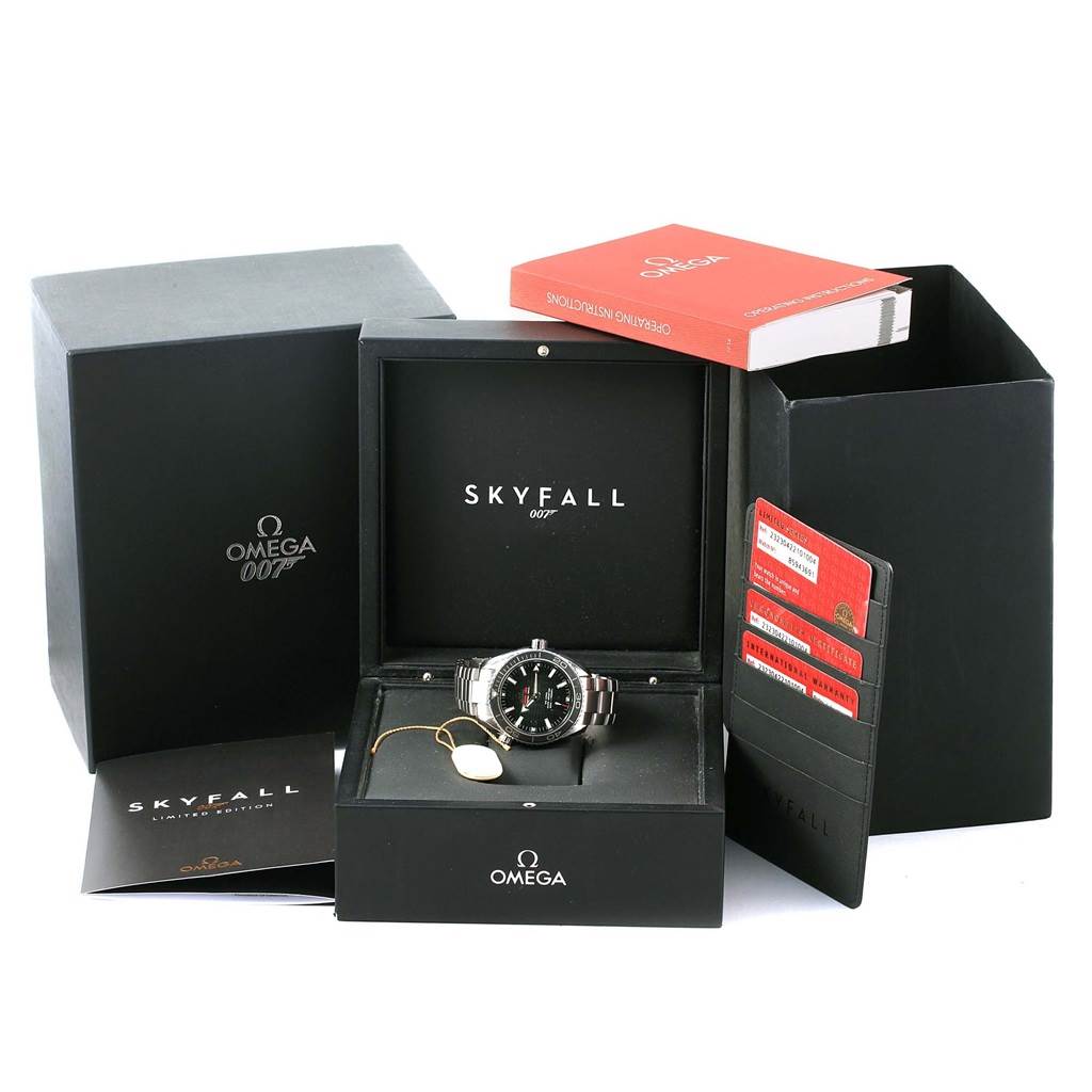 The image shows the Omega Planet Ocean 232.30.42.21.01.004 Men's Stainless Steel Black Dial 232.30.42.21.01.004 Men's Stainless Steel Black Dial watch in its box, along with operation instructions, a warranty card, and other accessories.