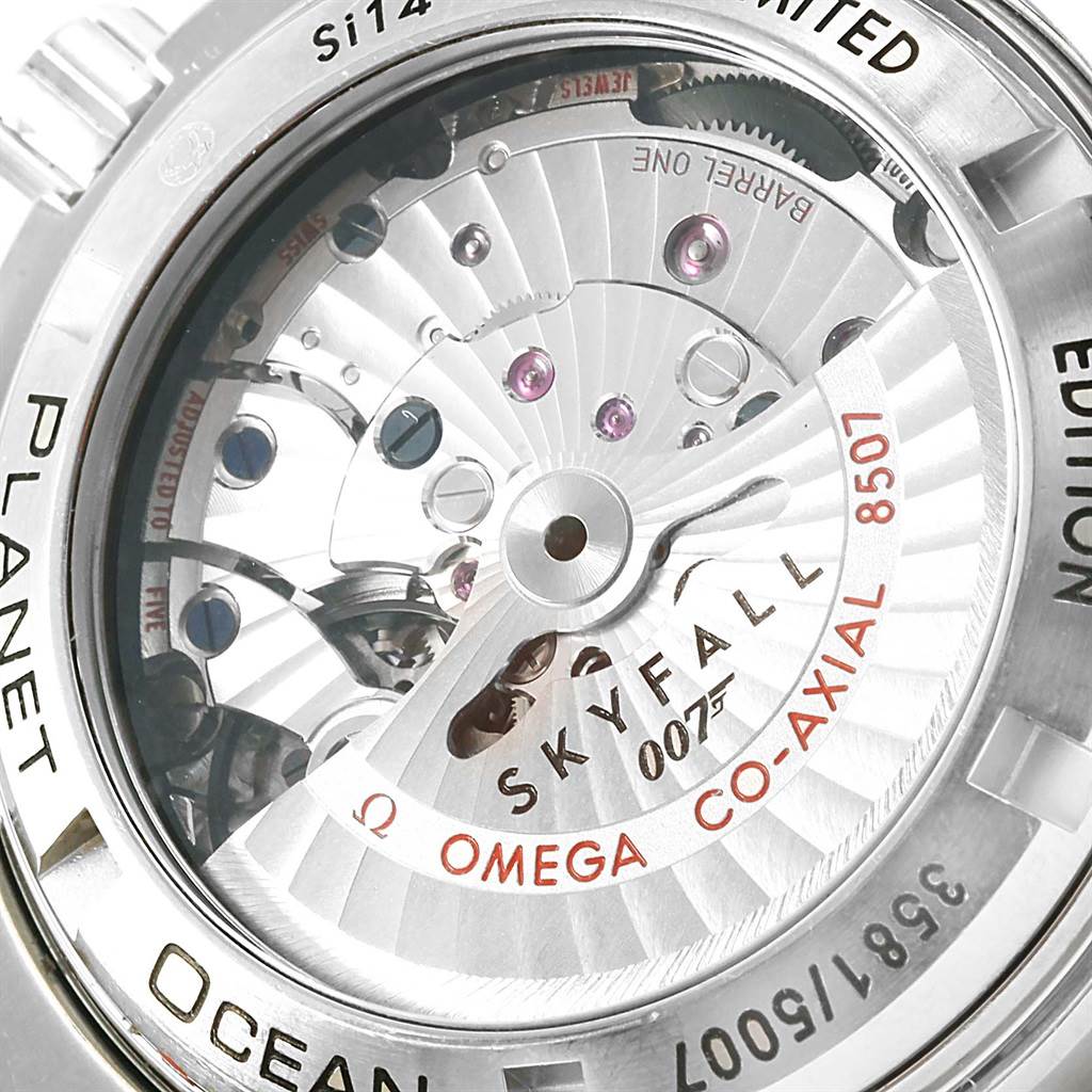 The image shows the back of an Omega Planet Ocean 232.30.42.21.01.004 Men's Stainless Steel Black Dial 232.30.42.21.01.004 Men's Stainless Steel Black Dial watch, specifically highlighting the movement and inscriptions.
