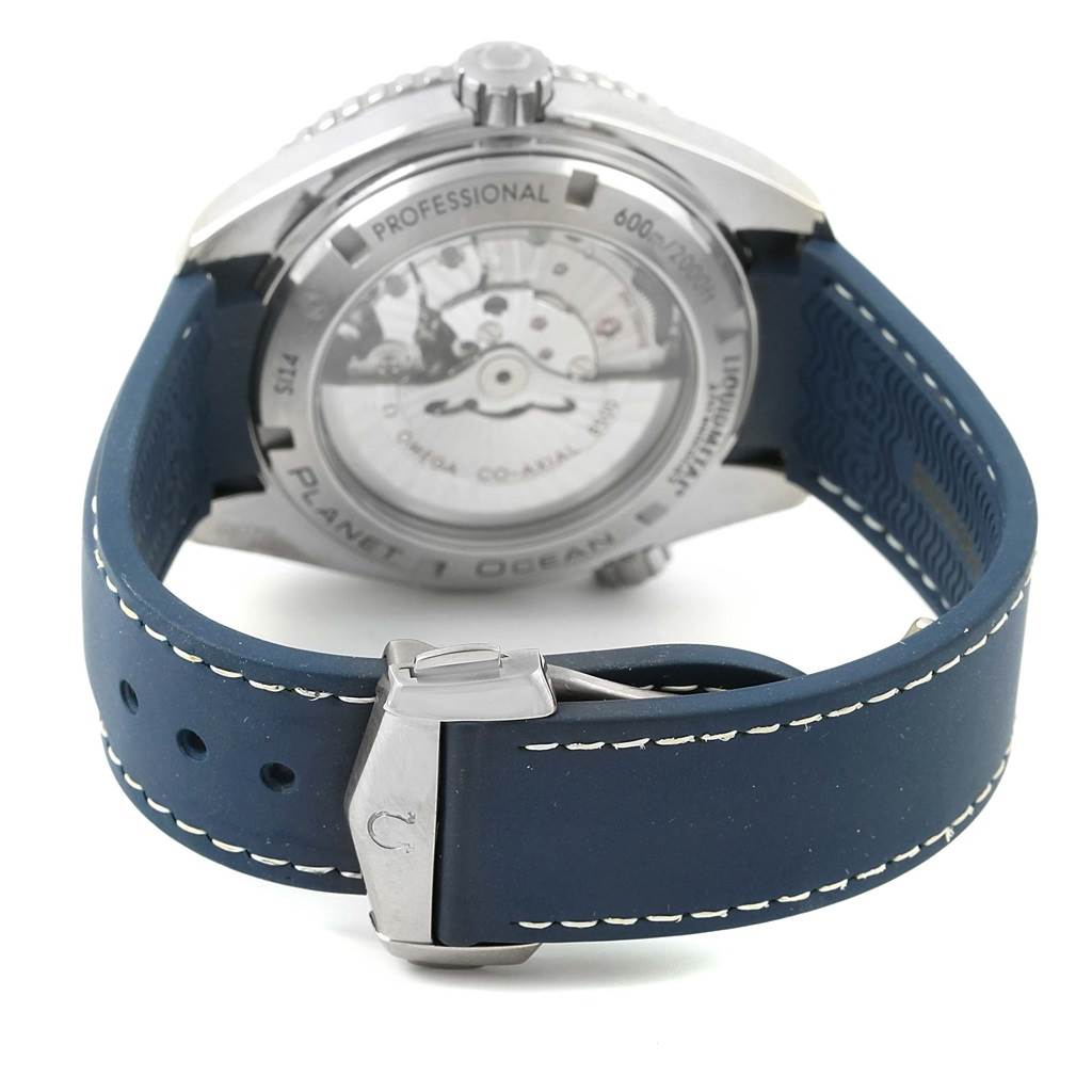 The image shows the back view of the Omega Planet Ocean 232.92.42.21.03.001 Men's Titanium Blue Dial 232.92.42.21.03.001 Men's Titanium Blue Dial watch, featuring the exhibition case back and blue rubber strap with a clasp.