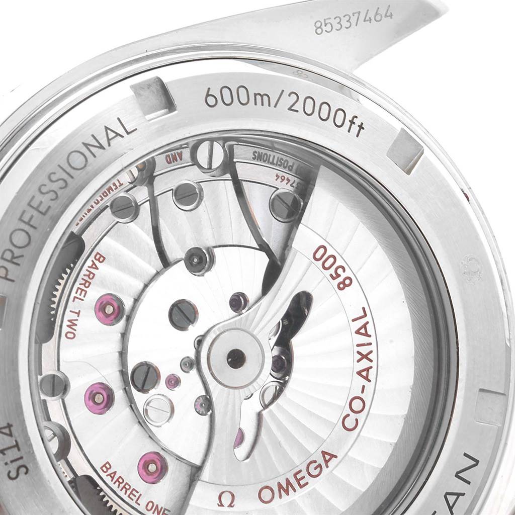 The image shows the back view of the Omega Planet Ocean 232.30.46.21.01.003 Men
s Stainless Steel Black Dial 232.30.46.21.01.003 Men
s Stainless Steel Black Dial watch, highlighting its internal Co-Axial 8500 movement and depth rating.