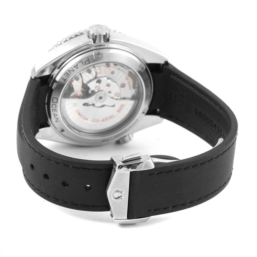 The image shows the back view of an Omega Planet Ocean 232.32.44.22.01.001 Men's Stainless Steel Black Dial 232.32.44.22.01.001 Men's Stainless Steel Black Dial watch, highlighting the transparent case back and rubber strap with clasp.