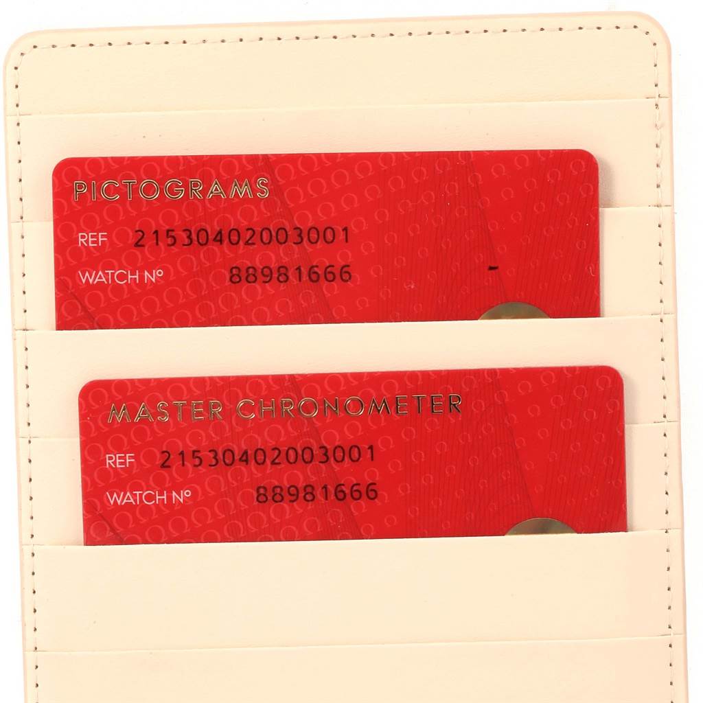 The image shows the warranty and certification cards for an Omega Planet Ocean 215.30.40.20.03.001 Men's Stainless Steel Blue Dial 215.30.40.20.03.001 Men's Stainless Steel Blue Dial watch, placed in a cream-colored cardholder.