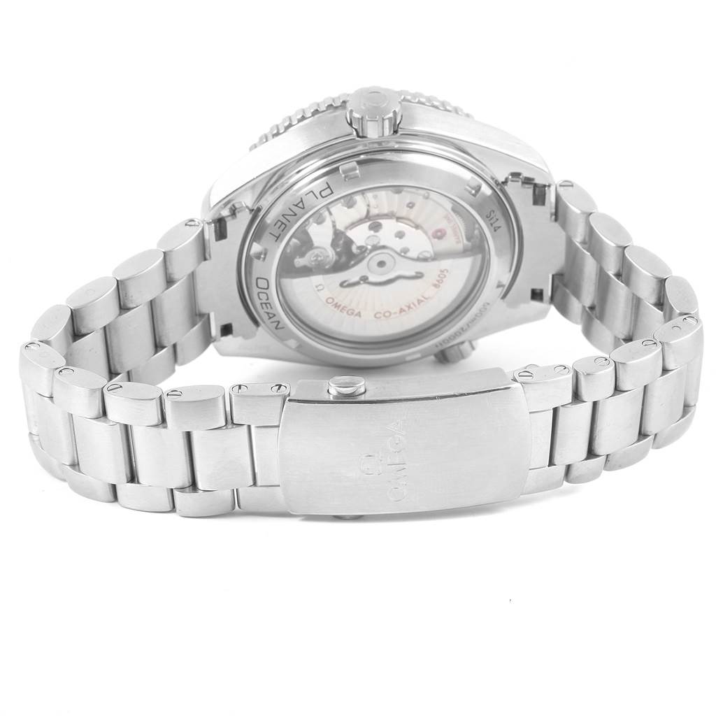 The image shows the back view of the Omega Planet Ocean 232.30.44.22.01.001 Men's Stainless Steel Black Dial 232.30.44.22.01.001 Men's Stainless Steel Black Dial watch, highlighting the movement mechanism and the metal bracelet clasp.