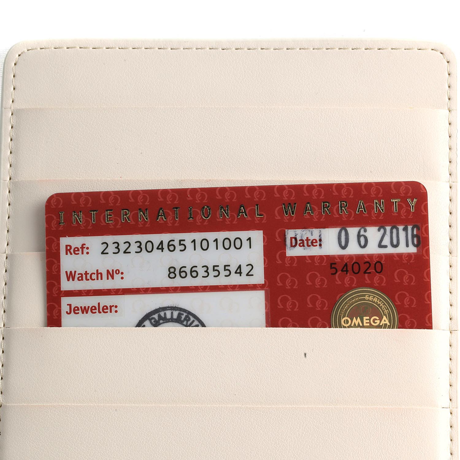 The image shows the international warranty card for an Omega Planet Ocean 232.30.46.51.01.001 Men
s Stainless Steel Black Dial 232.30.46.51.01.001 Men
s Stainless Steel Black Dial watch, tucked into a beige holder.