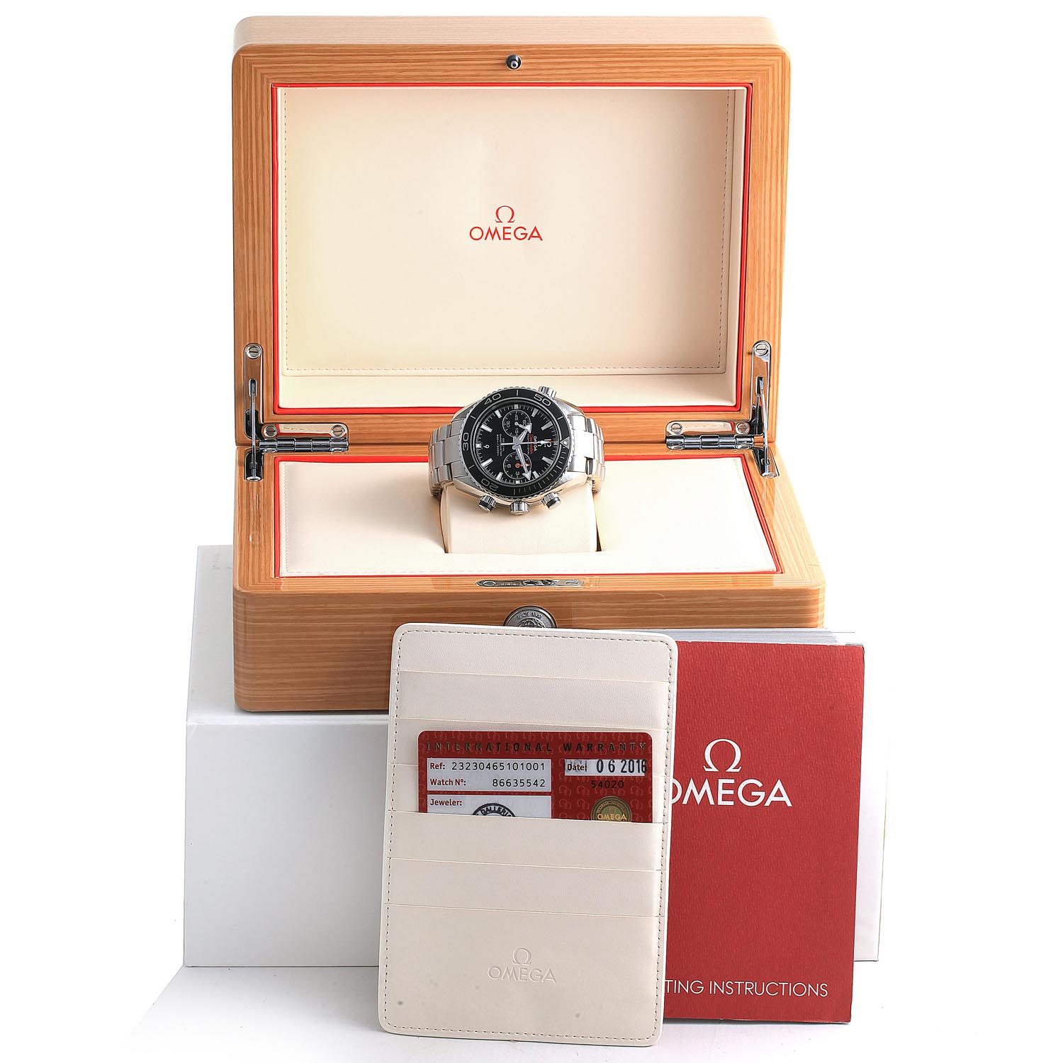 The Omega Planet Ocean 232.30.46.51.01.001 Men
s Stainless Steel Black Dial 232.30.46.51.01.001 Men
s Stainless Steel Black Dial watch is displayed in an open box, with a warranty card and manual in the foreground.