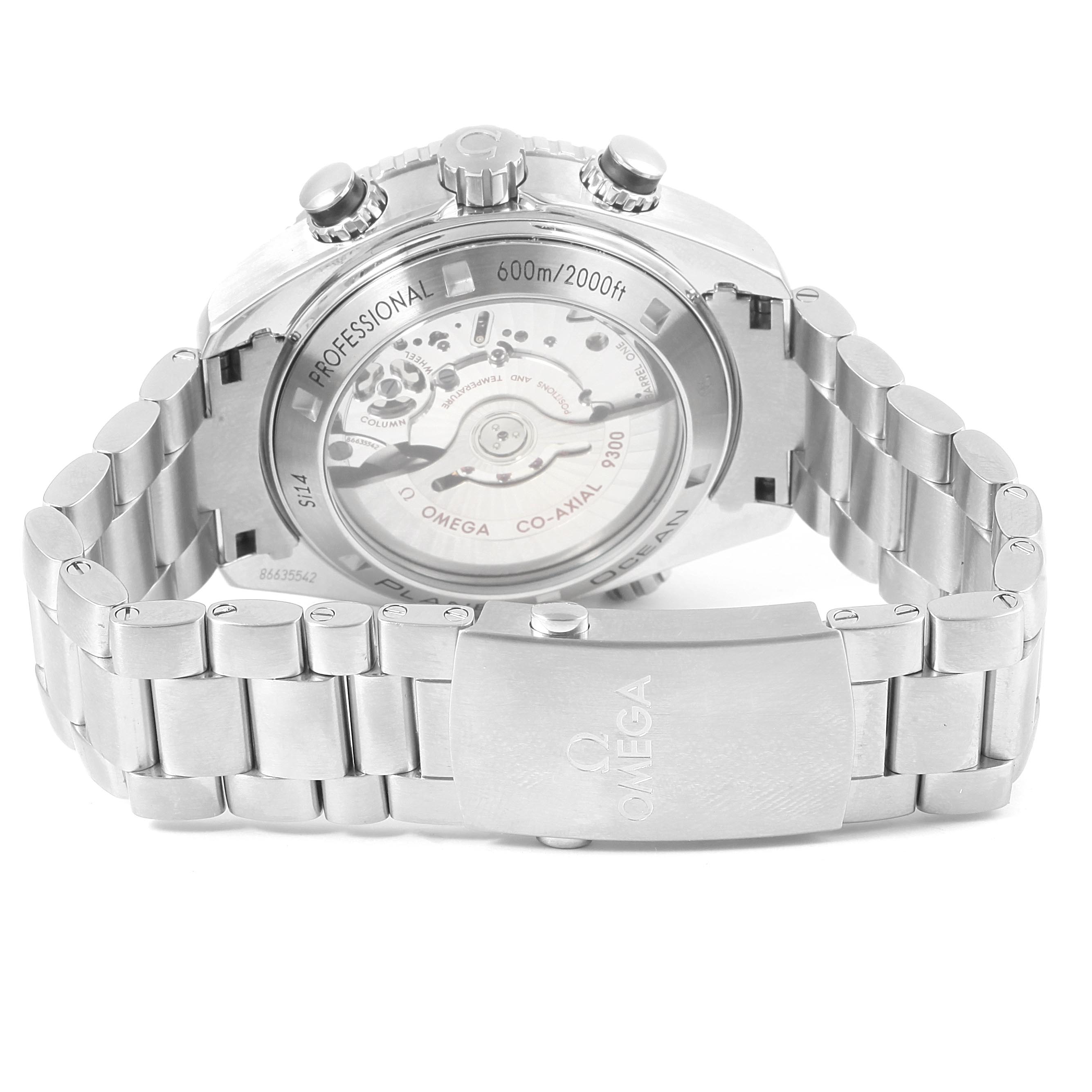 The image shows the back view of an Omega Planet Ocean 232.30.46.51.01.001 Men
s Stainless Steel Black Dial 232.30.46.51.01.001 Men
s Stainless Steel Black Dial watch, highlighting the transparent caseback and bracelet clasp.