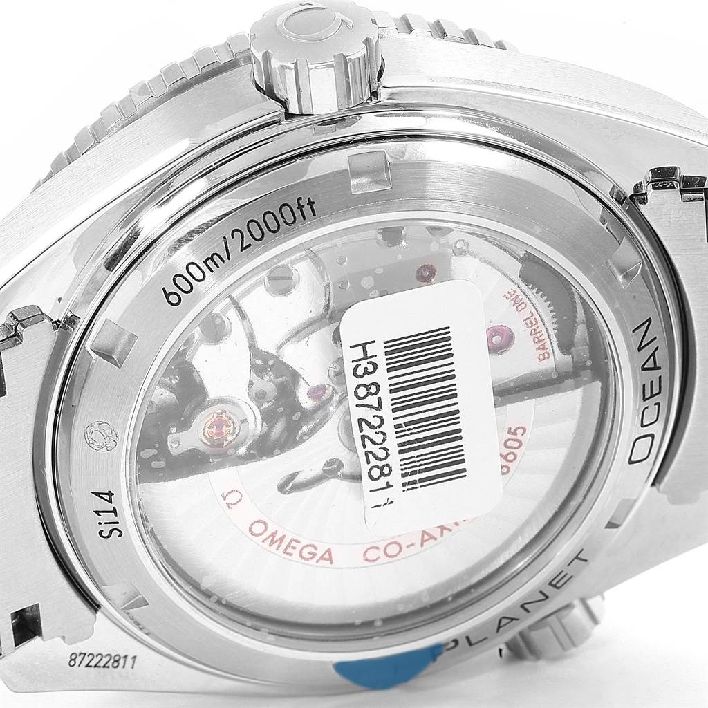 The image shows the back case of the Omega Planet Ocean 232.30.44.22.01.001 Men
s Stainless Steel Black Dial 232.30.44.22.01.001 Men
s Stainless Steel Black Dial watch, highlighting the transparent case back, crown, and water resistance marking.