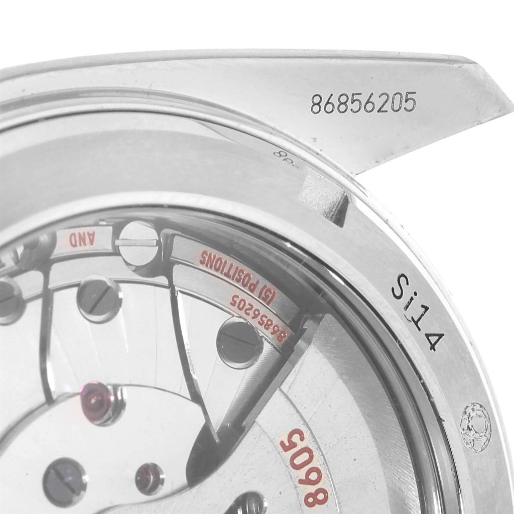 The image shows a close-up of the movement and serial number of the Omega Planet Ocean 232.30.44.22.01.001 Men
s Stainless Steel Black Dial 232.30.44.22.01.001 Men
s Stainless Steel Black Dial watch.