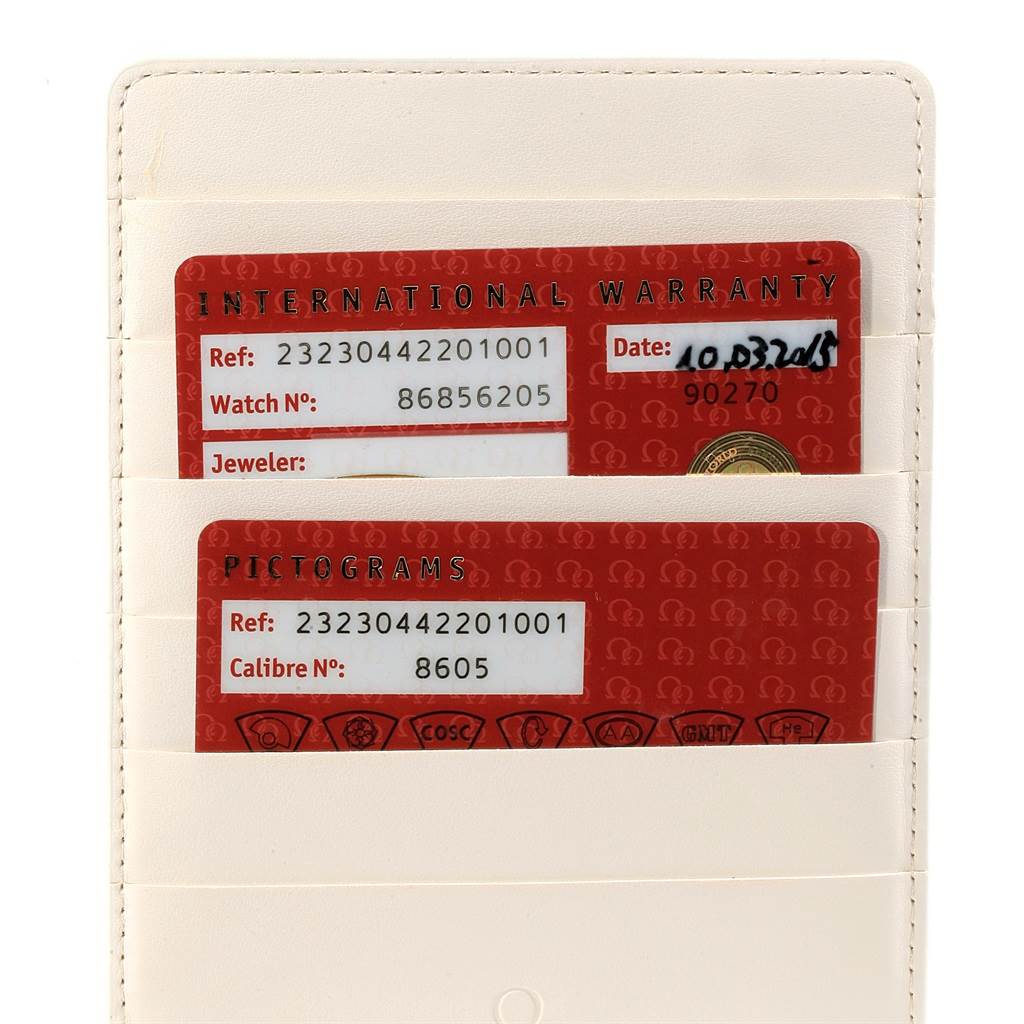 The image shows the International Warranty and Pictograms cards for an Omega Planet Ocean 232.30.44.22.01.001 Men
s Stainless Steel Black Dial 232.30.44.22.01.001 Men
s Stainless Steel Black Dial watch in a white card holder.