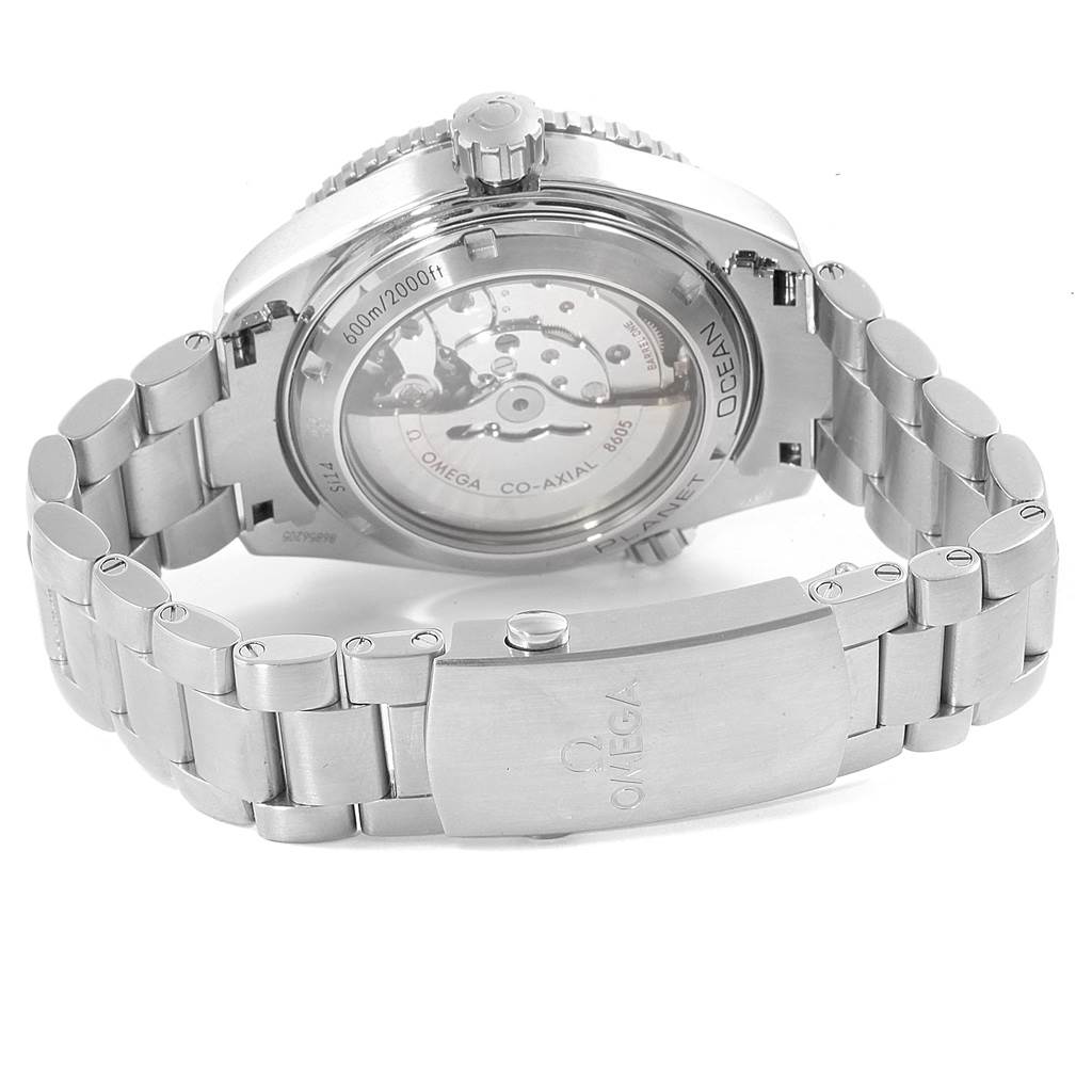 The image shows the back view of an Omega Planet Ocean 232.30.44.22.01.001 Men
s Stainless Steel Black Dial 232.30.44.22.01.001 Men
s Stainless Steel Black Dial watch, highlighting the transparent case back, crown, and metal bracelet.