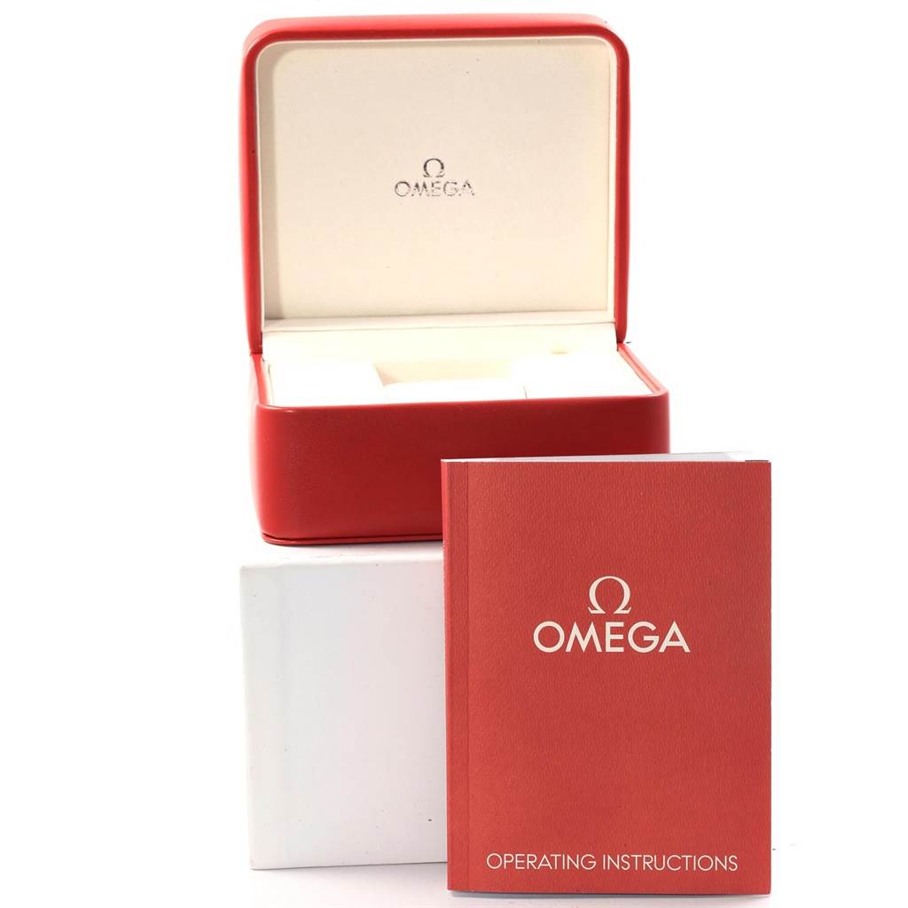 The image shows the Omega Planet Ocean 232.30.46.51.01.003 Men's Stainless Steel Black Dial 232.30.46.51.01.003 Men's Stainless Steel Black Dial watch box and operating instructions manual, with the box open and manual standing in front.