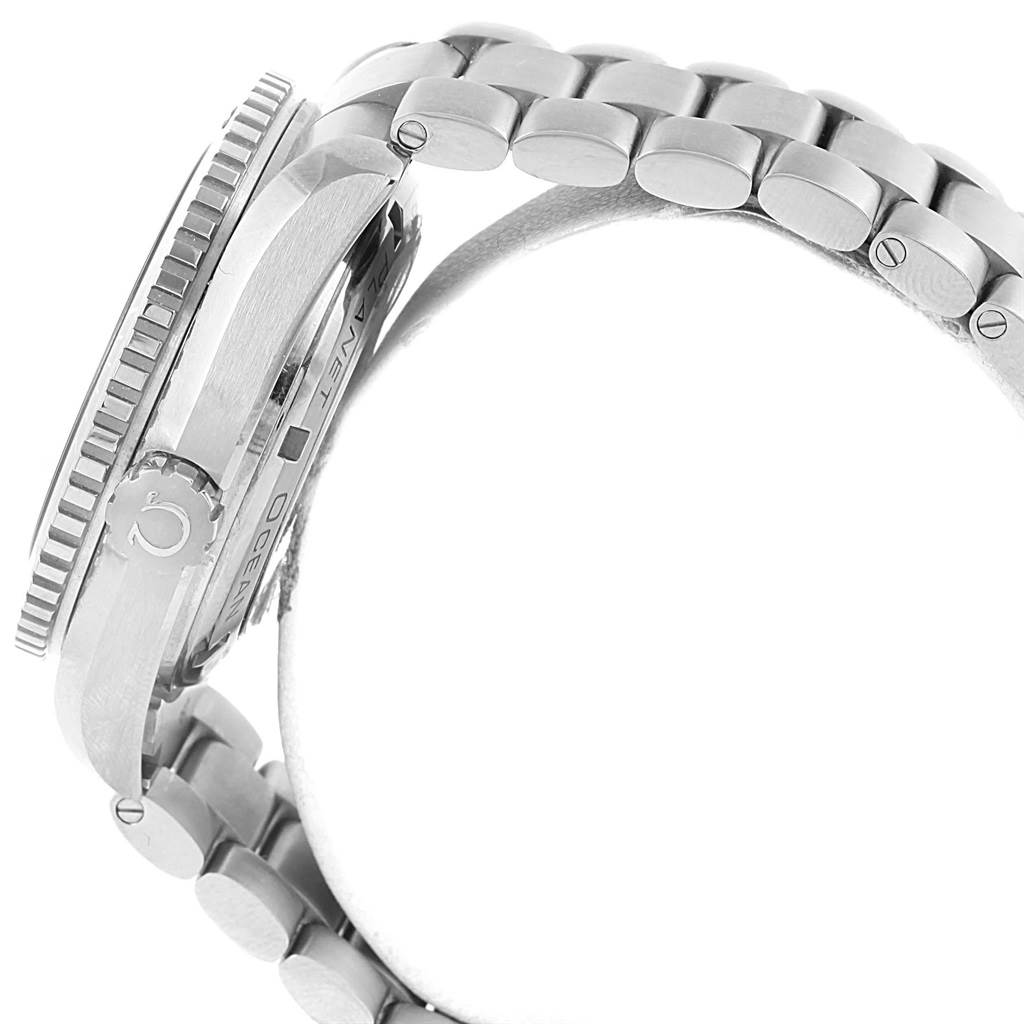 The image shows a side view of an Omega Planet Ocean 232.90.46.21.03.001 Men's Titanium Blue Dial 232.90.46.21.03.001 Men's Titanium Blue Dial watch, highlighting the crown and part of the bracelet.