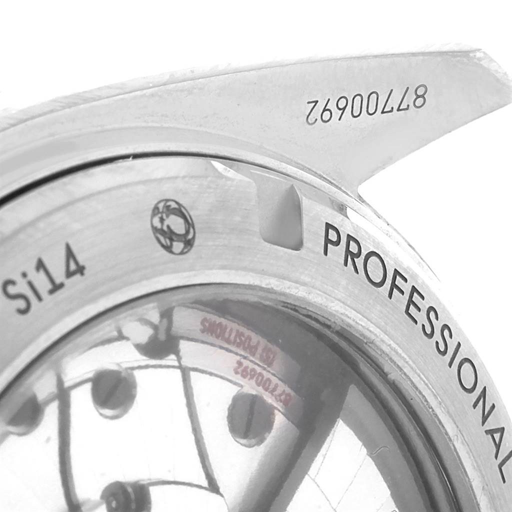 This image shows a close-up of the case back and part of the bezel of the Omega Planet Ocean 232.90.46.21.03.001 Men's Titanium Blue Dial 232.90.46.21.03.001 Men's Titanium Blue Dial watch model.