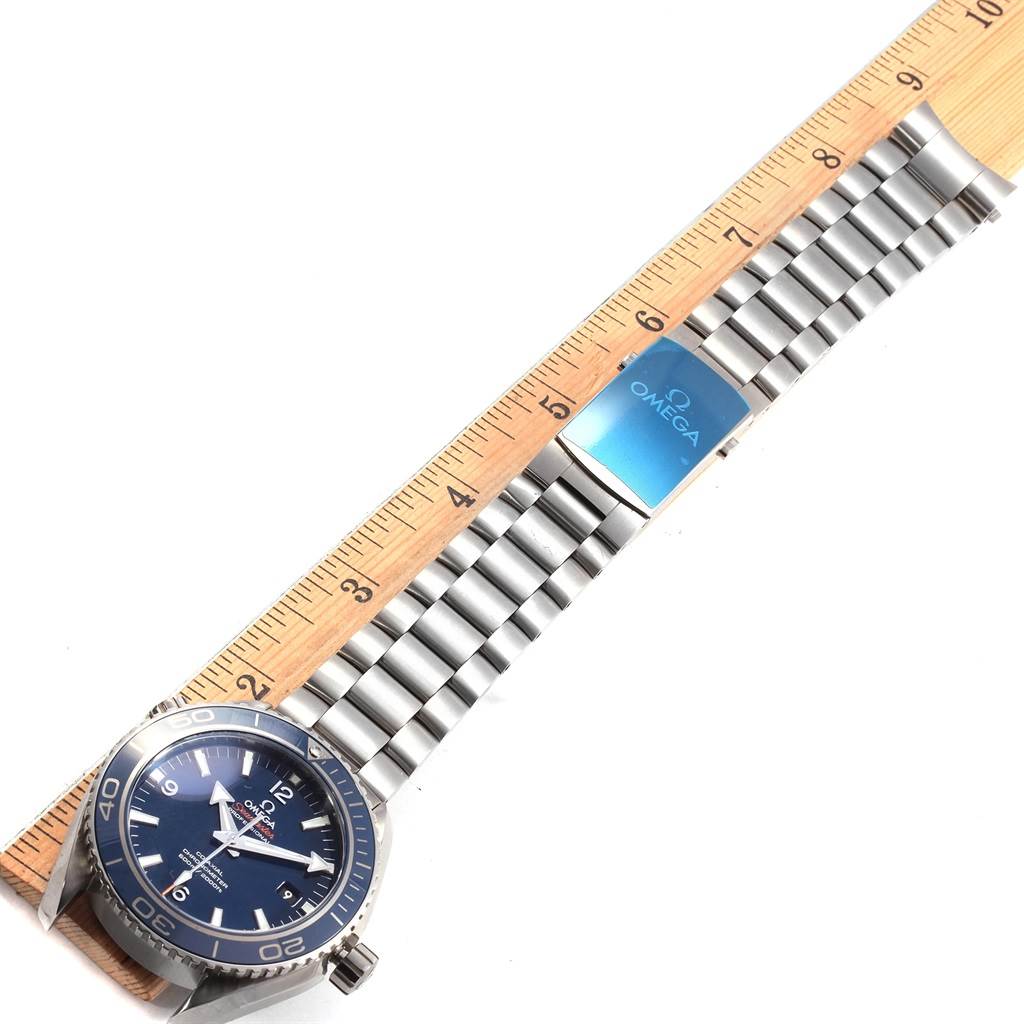 The Omega Planet Ocean 232.90.46.21.03.001 Men's Titanium Blue Dial 232.90.46.21.03.001 Men's Titanium Blue Dial watch is shown from the front, displaying its face and stainless steel band.