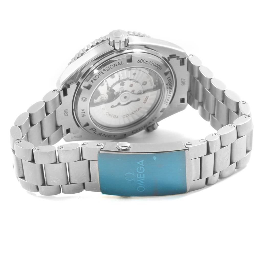 The image shows the back and the clasp of an Omega Planet Ocean 232.90.46.21.03.001 Men's Titanium Blue Dial 232.90.46.21.03.001 Men's Titanium Blue Dial watch, highlighting its stainless steel bracelet and transparent case back.