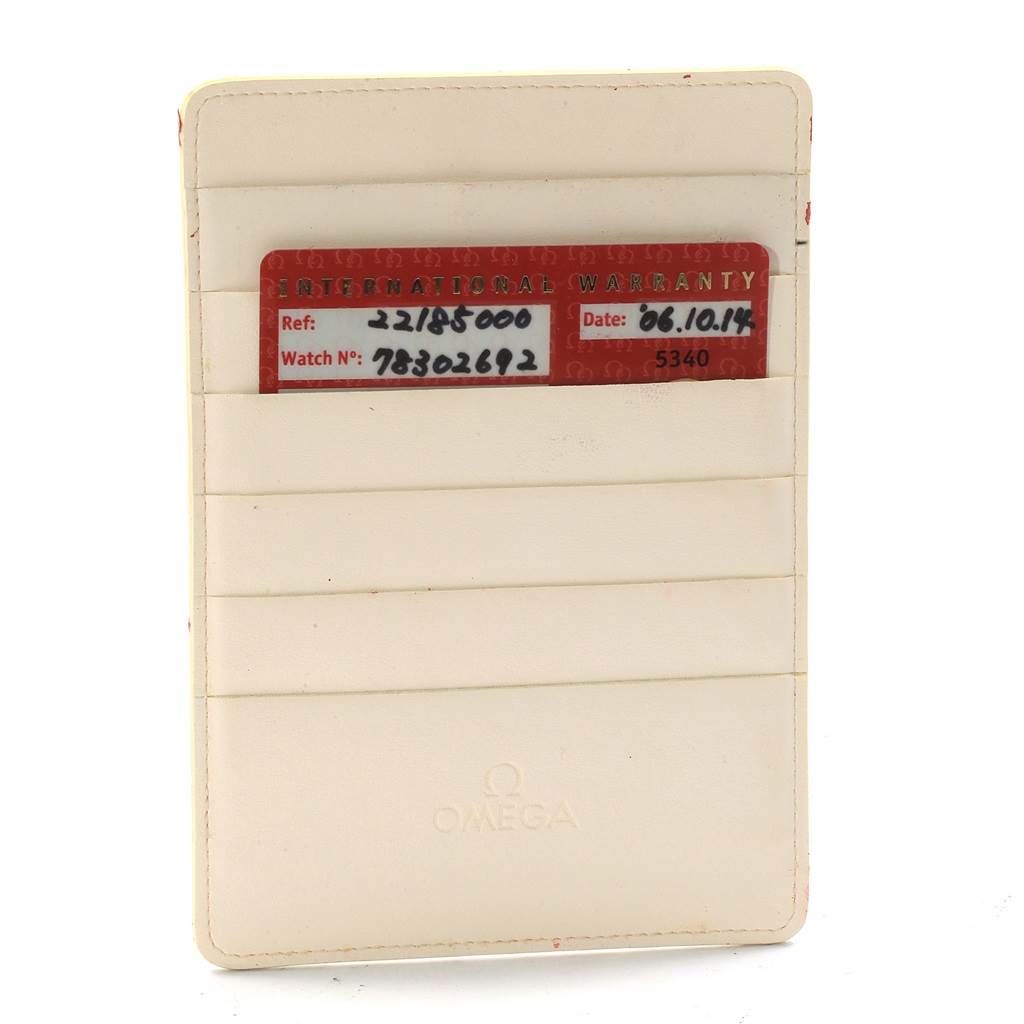 The image shows an Omega Planet Ocean 2218.50.00 Men
s Stainless Steel Black Dial 2218.50.00 Men
s Stainless Steel Black Dial model’s international warranty card in a white cardholder.