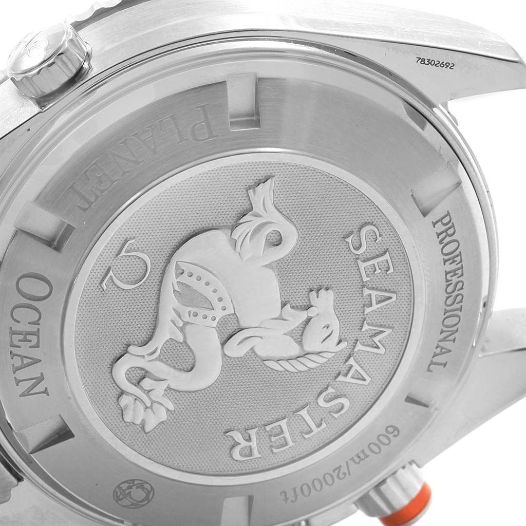 The image shows the back of an Omega Planet Ocean 2218.50.00 Men
s Stainless Steel Black Dial 2218.50.00 Men
s Stainless Steel Black Dial Seamaster watch, highlighting the engraved logo and text.