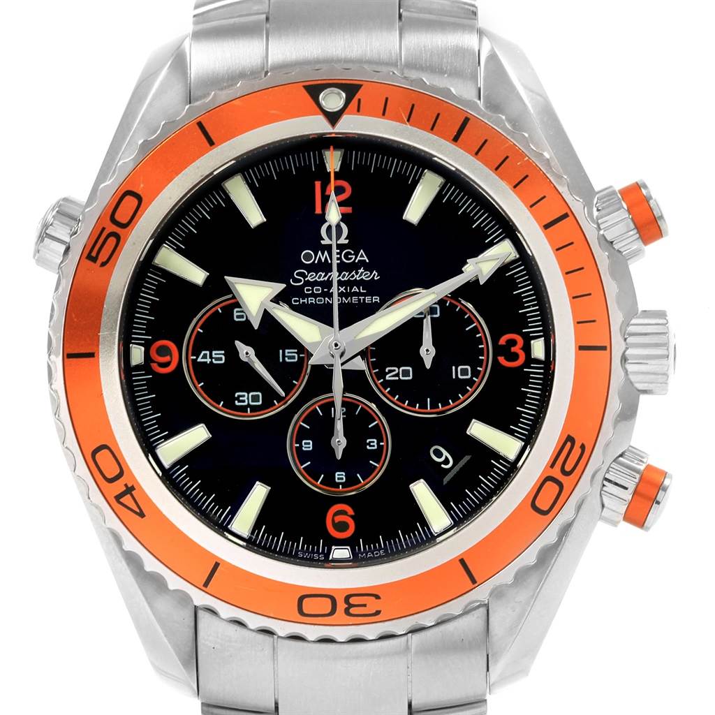 The image shows a front view of the Omega Planet Ocean 2218.50.00 Men
s Stainless Steel Black Dial 2218.50.00 Men
s Stainless Steel Black Dial model watch, highlighting its orange bezel, black dial, and chronograph features.