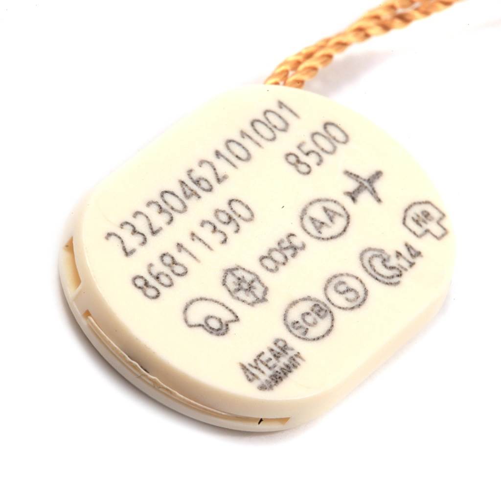 The image shows the hang tag of an Omega Planet Ocean 232.30.46.21.01.001 Men
s Stainless Steel Black Dial 232.30.46.21.01.001 Men
s Stainless Steel Black Dial watch, displaying reference numbers and certification symbols.