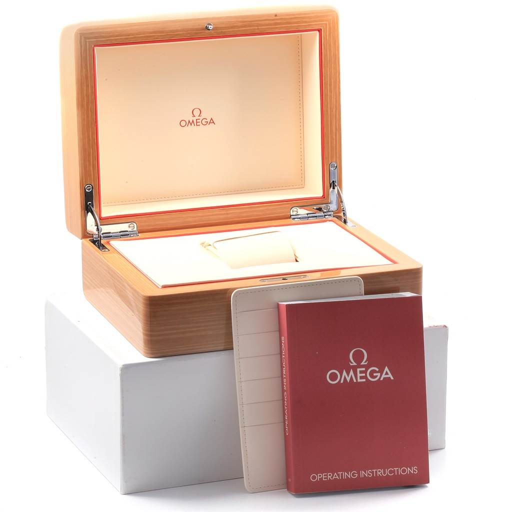 The image shows an open Omega Planet Ocean 232.30.46.51.01.002 Men
s Stainless Steel Black Dial 232.30.46.51.01.002 Men
s Stainless Steel Black Dial watch box with operating instructions and a cardholder.