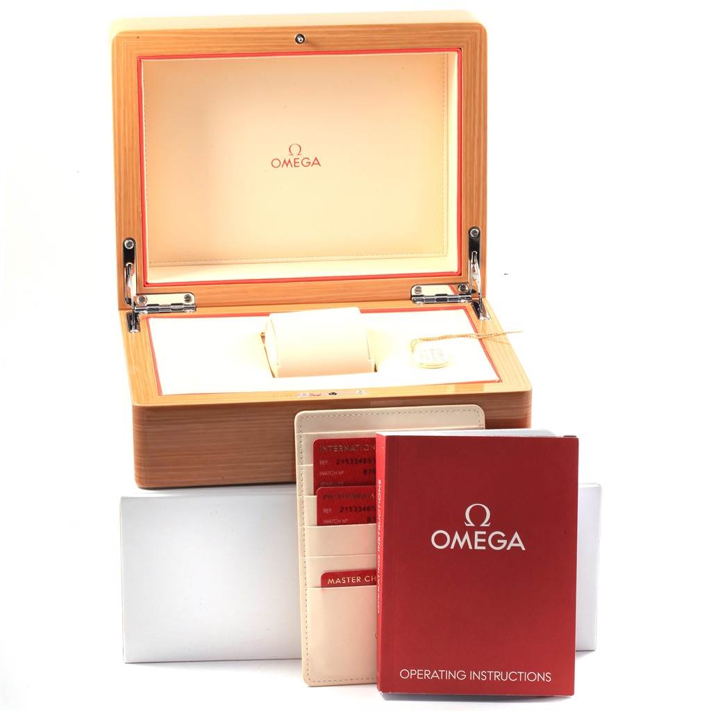 The image shows an Omega Planet Ocean 215.33.46.51.01.001 Men
s Stainless Steel Black Dial 215.33.46.51.01.001 Men
s Stainless Steel Black Dial watch box set, including the box, warranty cards, and operating instructions.