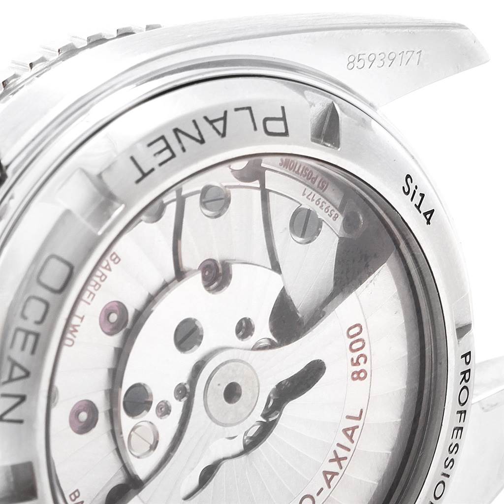 This shows a close-up of the Omega Planet Ocean 232.30.42.21.01.001 Men
s Stainless Steel Black Dial 232.30.42.21.01.001 Men
s Stainless Steel Black Dial model
s rear case, revealing the intricate mechanism and engravings.