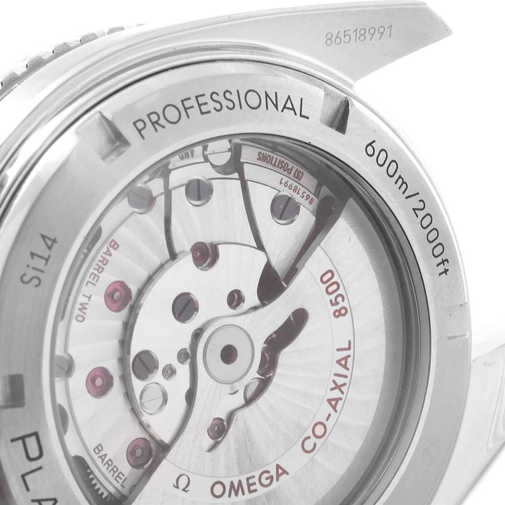 The image shows the back view of the Omega Planet Ocean 232.30.46.21.01.001 Men
s Stainless Steel Black Dial 232.30.46.21.01.001 Men
s Stainless Steel Black Dial watch, highlighting its movement and engravings.