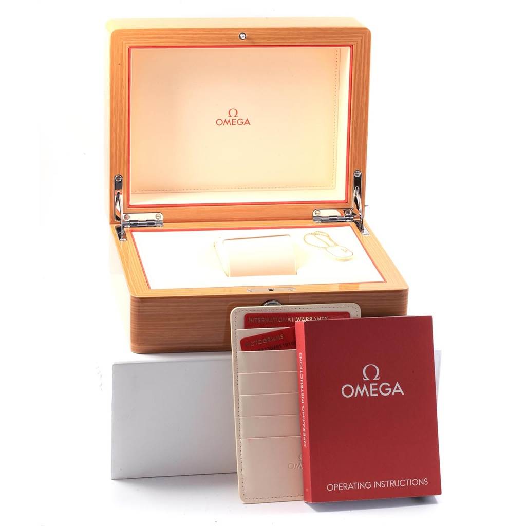 The image shows the open box, manuals, and warranty cards for an Omega Planet Ocean 232.30.46.51.01.003 Men
s Stainless Steel Black Dial 232.30.46.51.01.003 Men
s Stainless Steel Black Dial watch.