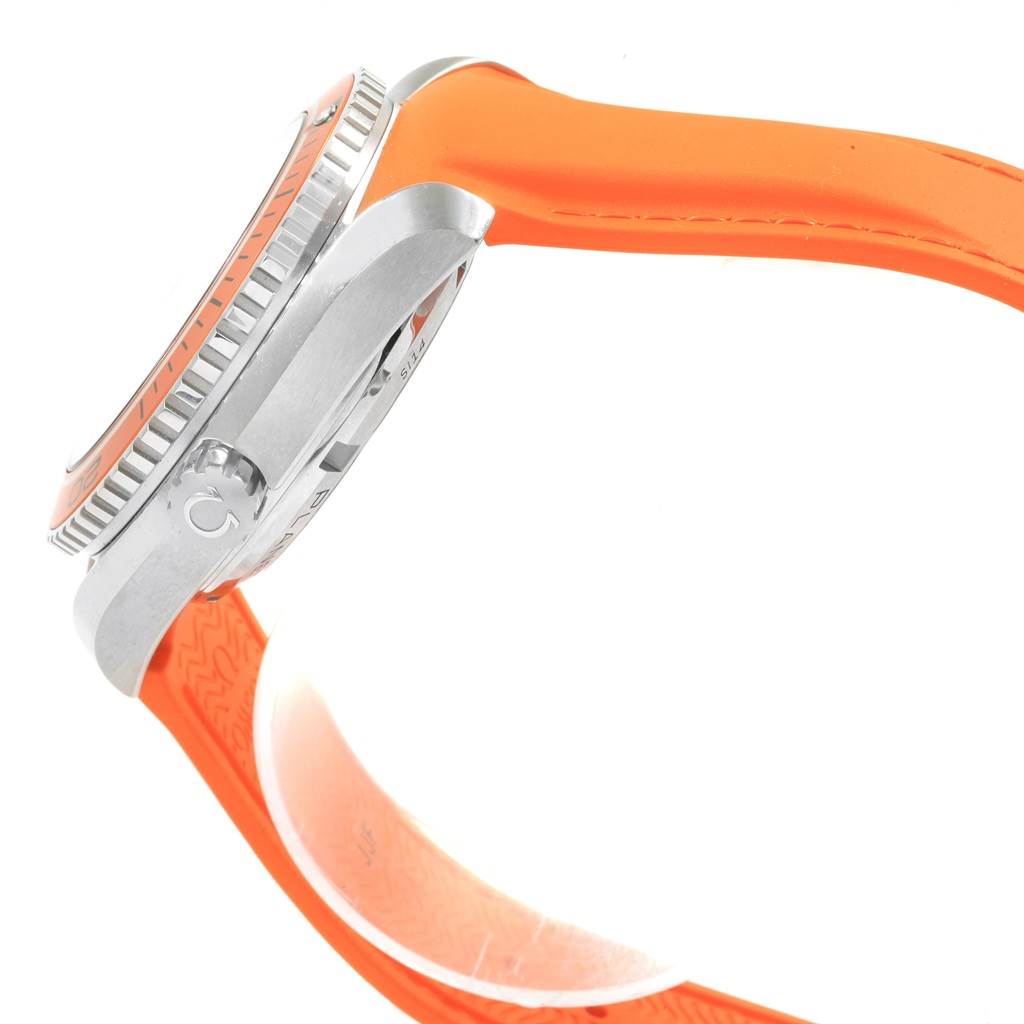 The image shows a side view of an Omega Planet Ocean 232.32.42.21.01.001 Men
s Stainless Steel Black Dial 232.32.42.21.01.001 Men
s Stainless Steel Black Dial watch featuring an orange strap and bezel.