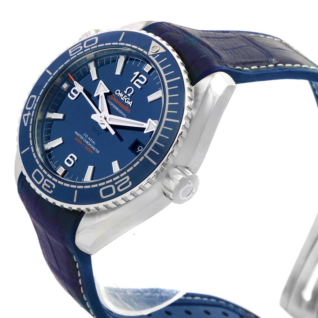 The image shows an angled view of an Omega Planet Ocean 215.33.44.21.03.001 Men
s Stainless Steel Blue Dial 215.33.44.21.03.001 Men
s Stainless Steel Blue Dial watch with a visible dial, bezel, and crown, with a blue strap.