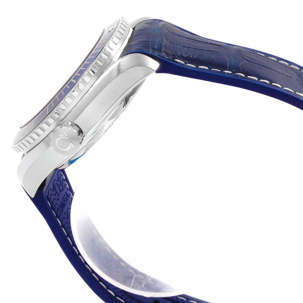 The image shows a side view of the Omega Planet Ocean 215.33.44.21.03.001 Men
s Stainless Steel Blue Dial 215.33.44.21.03.001 Men
s Stainless Steel Blue Dial watch, focusing on the case, bezel, and crown, with part of the strap visible.