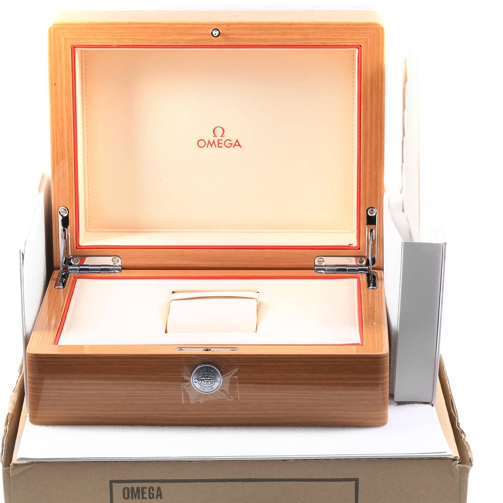 An open Omega Planet Ocean 215.33.44.21.03.001 Men
s Stainless Steel Blue Dial 215.33.44.21.03.001 Men
s Stainless Steel Blue Dial box is shown from the front, revealing its interior and cushion for the watch.