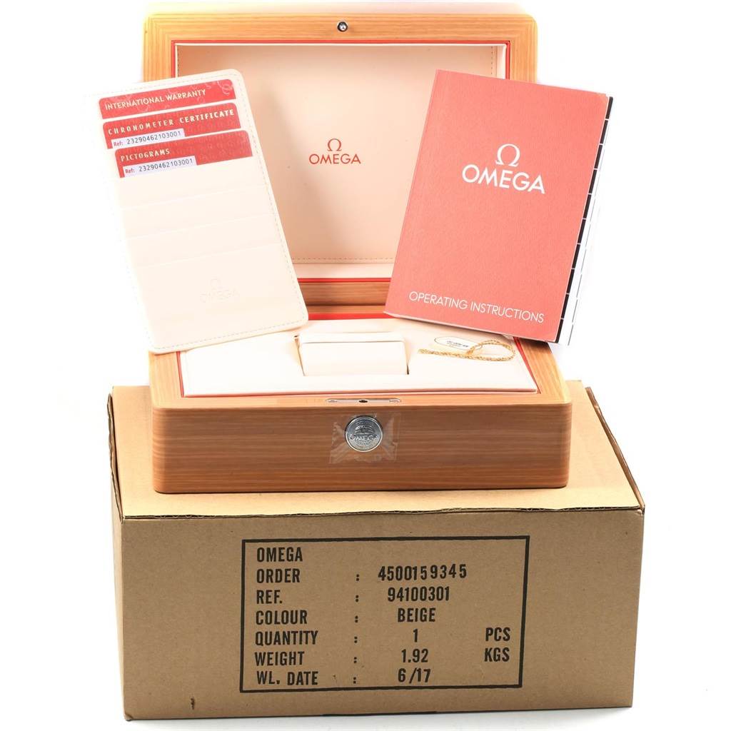 The image shows accessories for an Omega Planet Ocean 232.90.46.21.03.001 Men's Titanium Blue Dial 232.90.46.21.03.001 Men's Titanium Blue Dial watch, including its box, operating instructions, and warranty card.