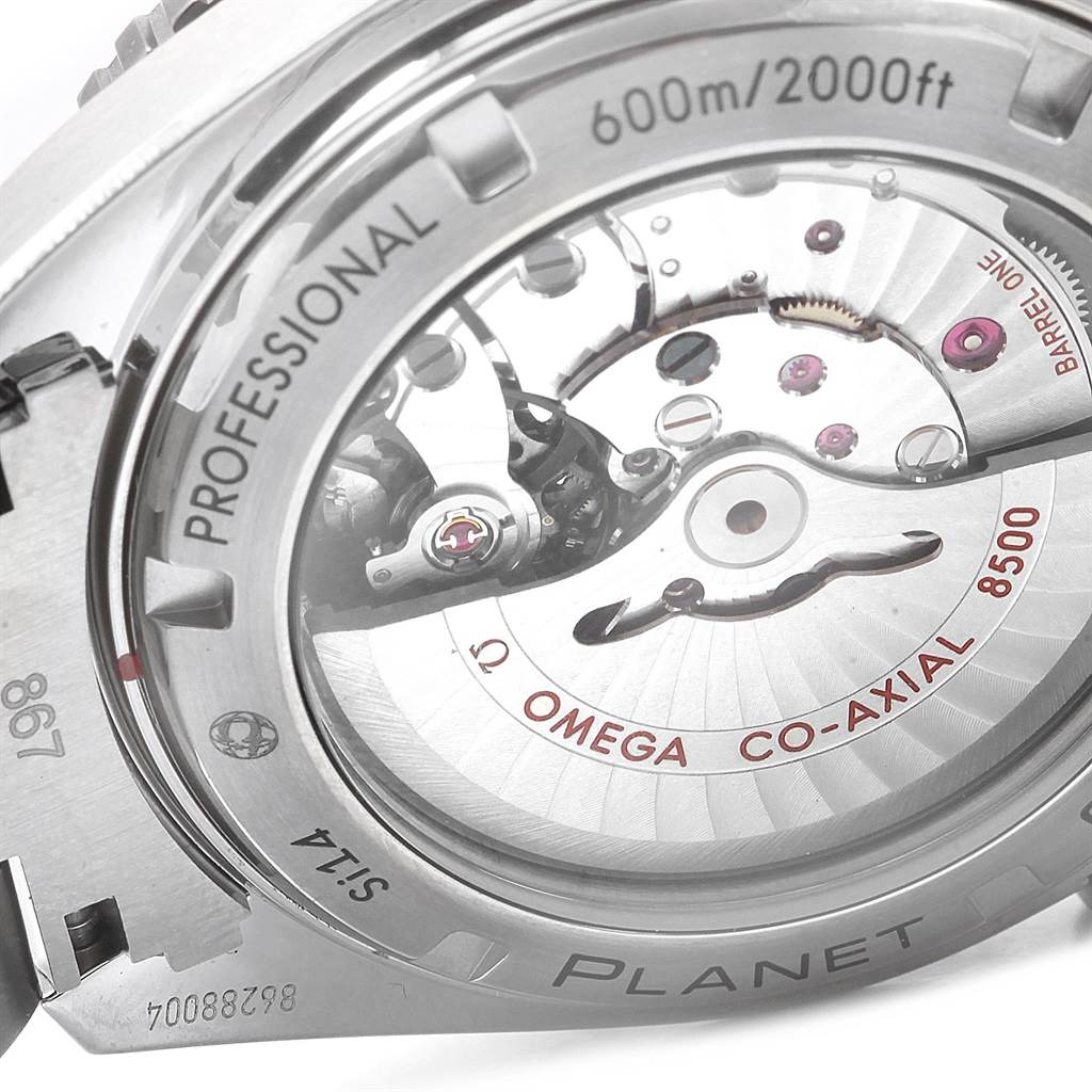 The image shows the back of the Omega Planet Ocean 232.90.46.21.03.001 Men's Titanium Blue Dial 232.90.46.21.03.001 Men's Titanium Blue Dial watch, revealing the Co-Axial 8500 movement and details like "600m/2000ft" and "Professional."