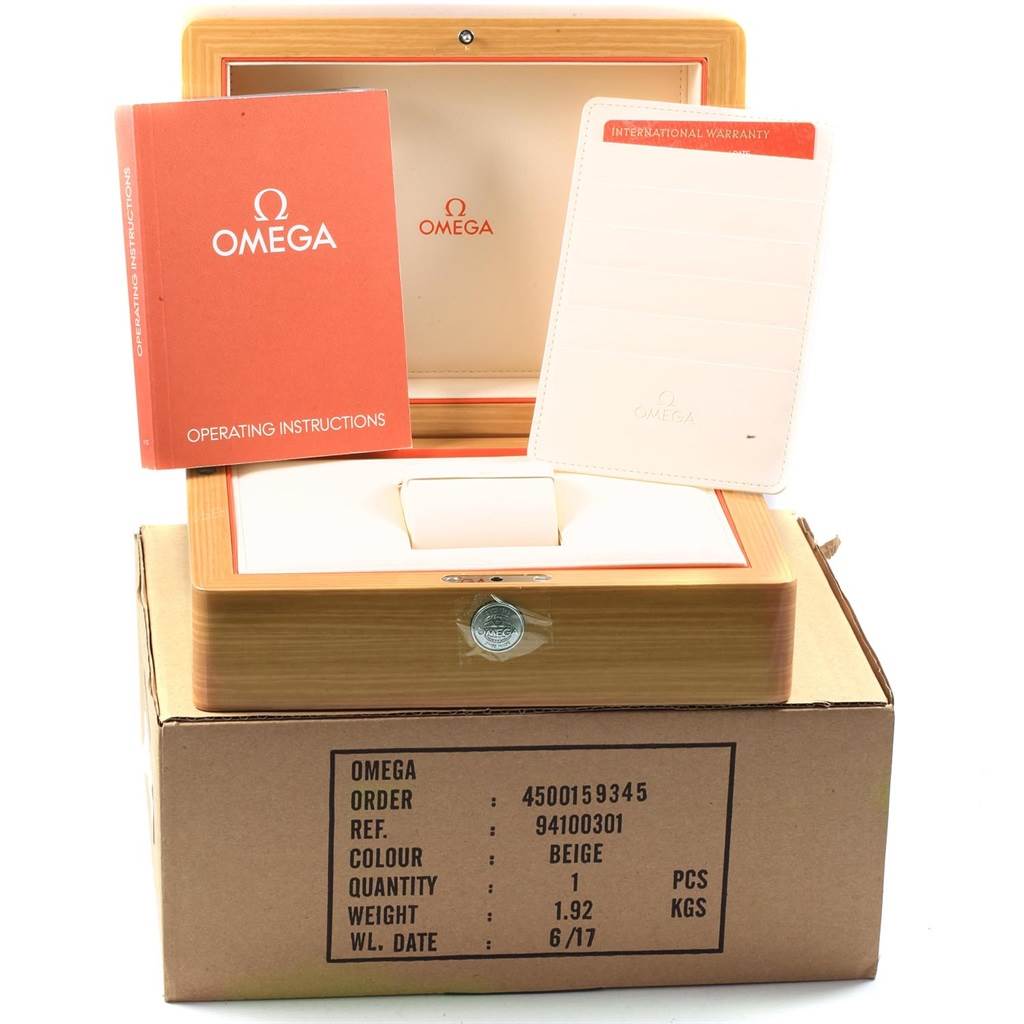 The image shows the Omega Planet Ocean 232.90.46.51.03.001 Men's Titanium Blue Dial 232.90.46.51.03.001 Men's Titanium Blue Dial watch's wooden box, operating instructions, and international warranty card.