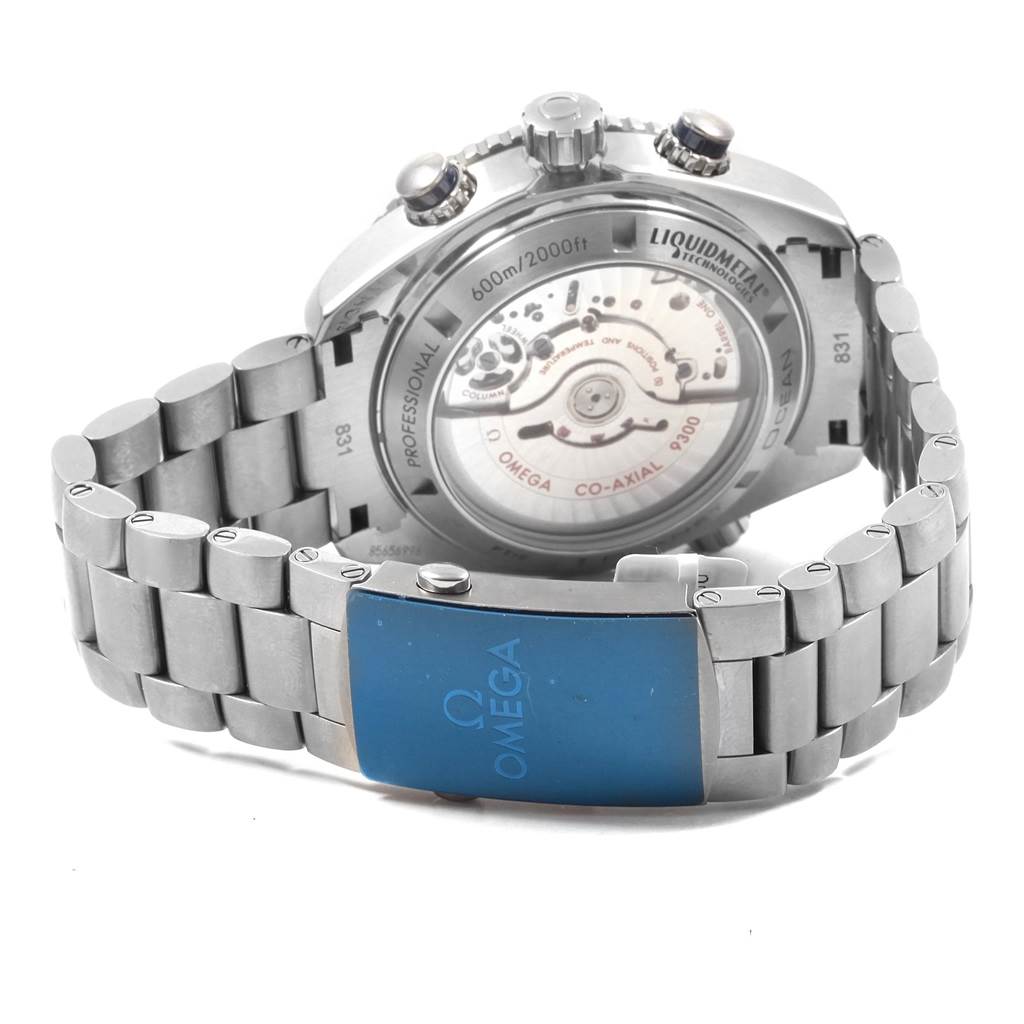 The image shows the back view of an Omega Planet Ocean 232.90.46.51.03.001 Men's Titanium Blue Dial 232.90.46.51.03.001 Men's Titanium Blue Dial watch, highlighting its bracelet and transparent case back.