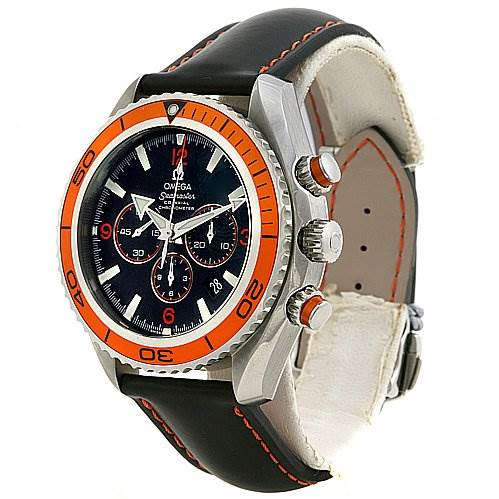 The image shows an Omega Planet Ocean 29185082 OR 2918.   50.   82 Men's Stainless Steel Black Dial 29185082 OR 2918.   50.   82 Men's Stainless Steel Black Dial watch viewed at an angle, highlighting the bezel, crown, and leather strap with orange stitching.