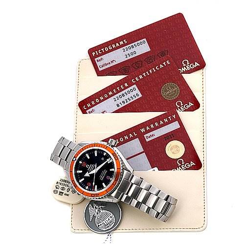 The image shows an Omega Planet Ocean 22085000 Men's Stainless Steel Black Dial 22085000 Men's Stainless Steel Black Dial watch with its bracelet, warranty cards, and certification documents at an angled top view.