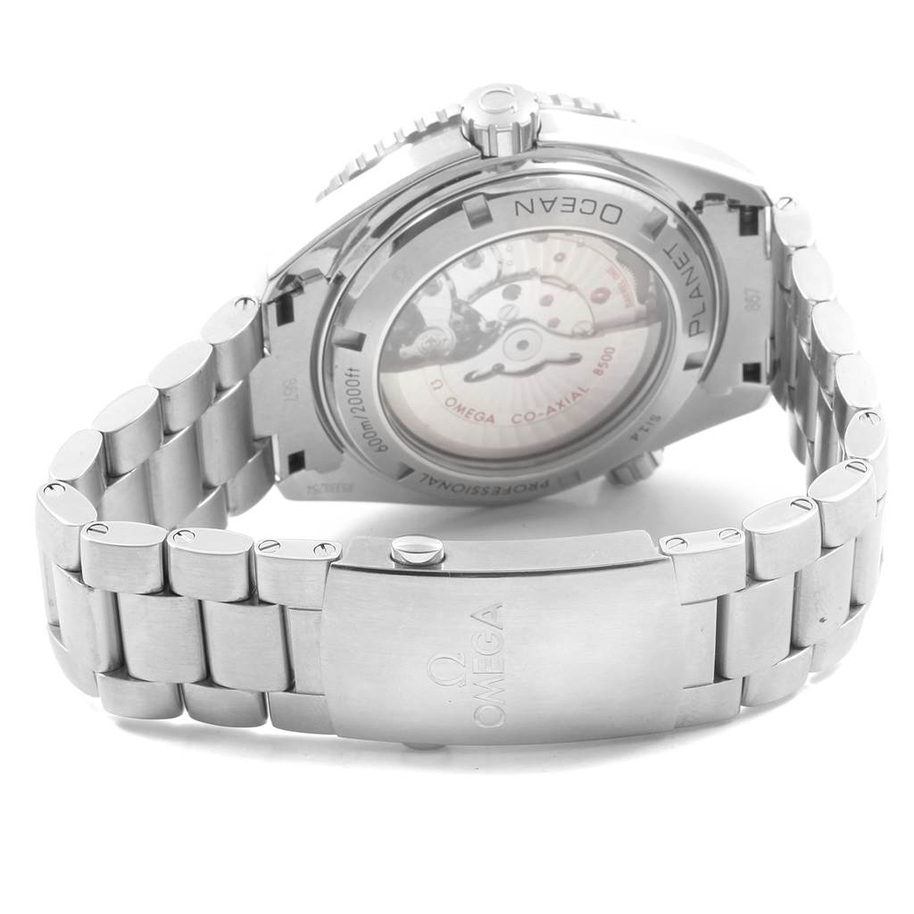 The image shows the back view of an Omega Planet Ocean 232.30.46.21.01.001 Men
s Stainless Steel Black Dial 232.30.46.21.01.001 Men
s Stainless Steel Black Dial watch, highlighting its clasp, bracelet, and visible movement.