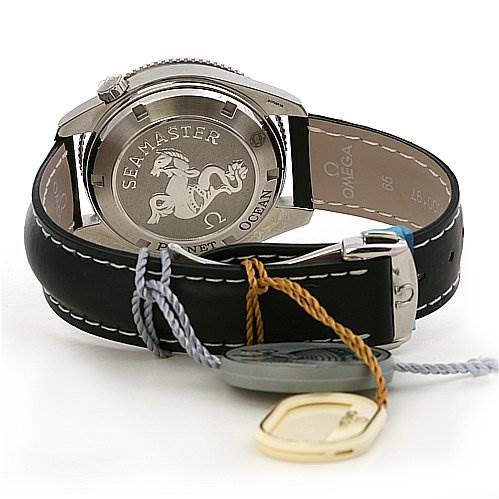 The Omega Planet Ocean 29015081 OR 2901.   50.   81 Men
s Stainless Steel Black Dial 29015081 OR 2901.   50.   81 Men
s Stainless Steel Black Dial watch is shown from the back, highlighting the case back, leather strap, and attached tags.