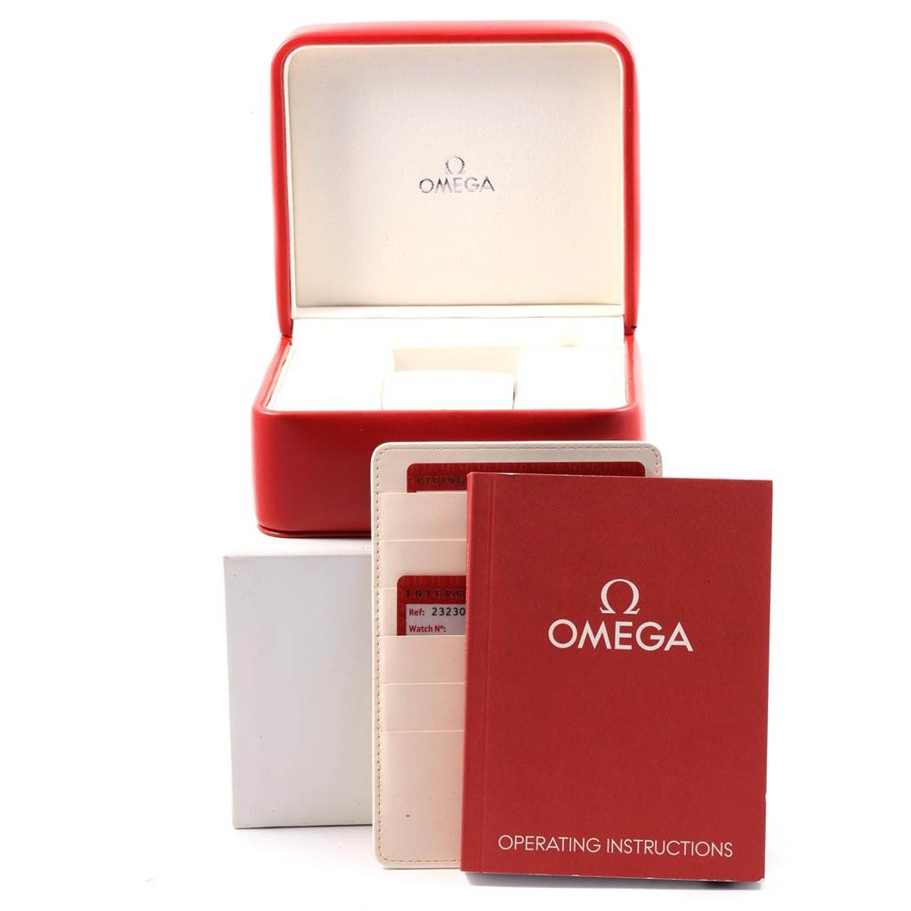 The image shows an open Omega Planet Ocean 232.30.46.51.01.003 Men's Stainless Steel Black Dial 232.30.46.51.01.003 Men's Stainless Steel Black Dial watch box, operating instructions, and warranty card package from a frontal angle.