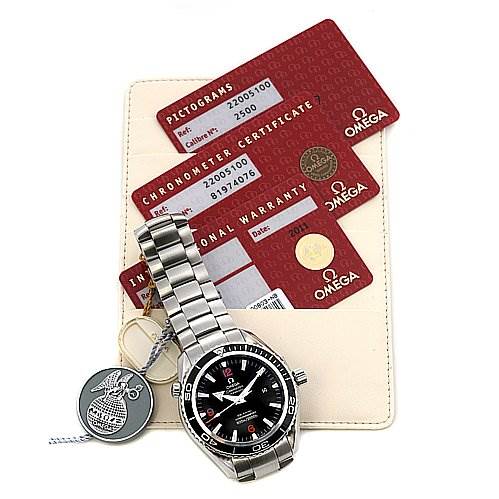 The image shows an Omega Planet Ocean 22005100 OR 2200.   51.   00 Men
s Stainless Steel Black Dial 22005100 OR 2200.   51.   00 Men
s Stainless Steel Black Dial watch at a slight angle and includes warranty cards, a certificate, and a tag.