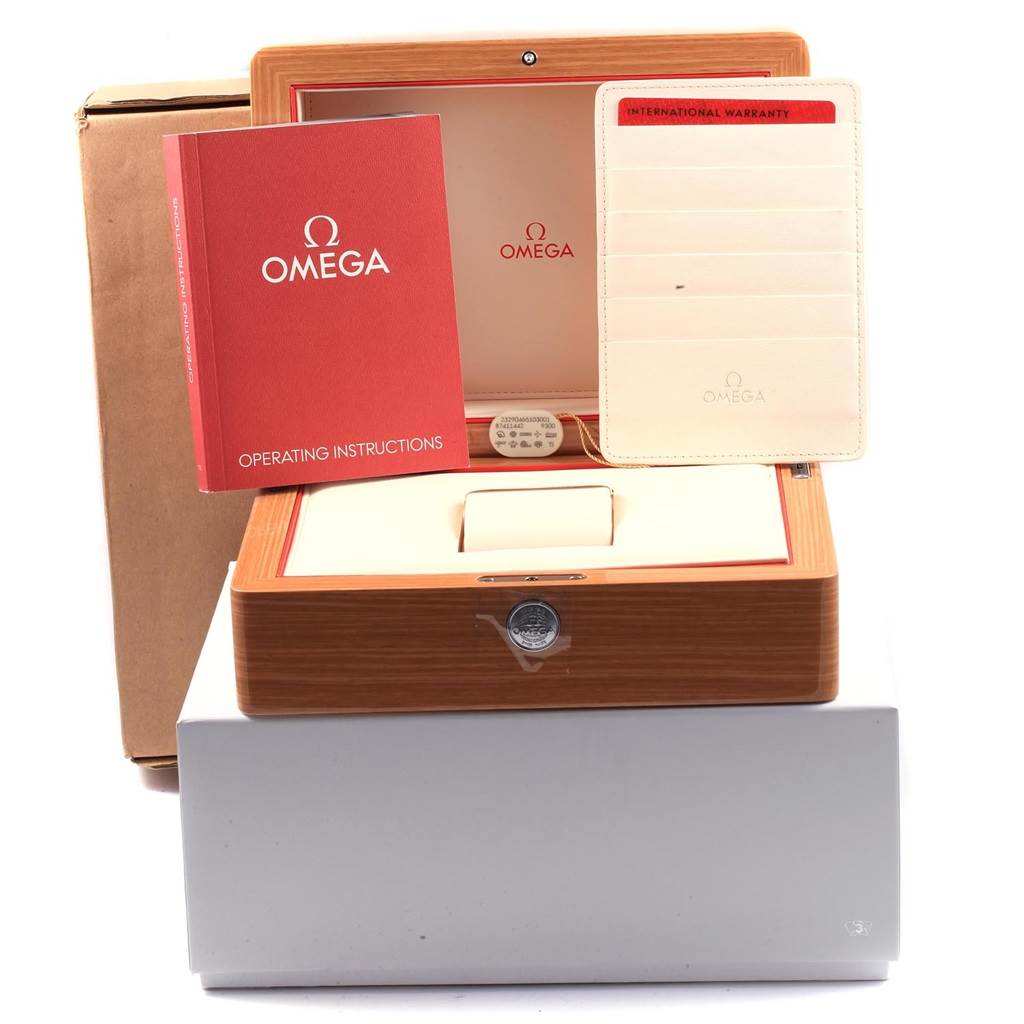 This image shows the packaging, international warranty, and operating instructions for an Omega Planet Ocean 87411442 Men's Titanium Blue Dial 87411442 Men's Titanium Blue Dial watch.