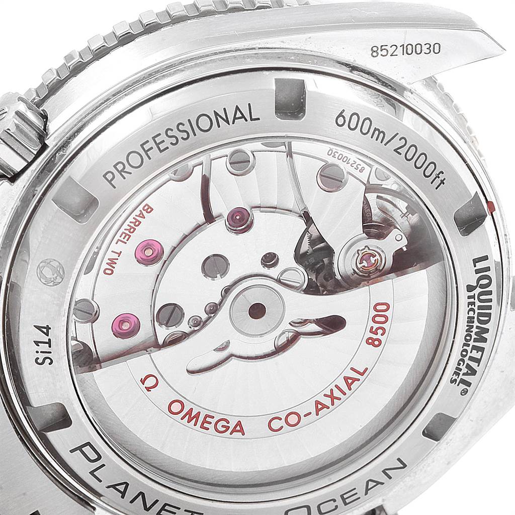 The image shows the back of the Omega Planet Ocean 232.90.42.21.03.001 Men's Titanium Blue Dial 232.90.42.21.03.001 Men's Titanium Blue Dial watch, highlighting its co-axial movement and internal mechanisms.