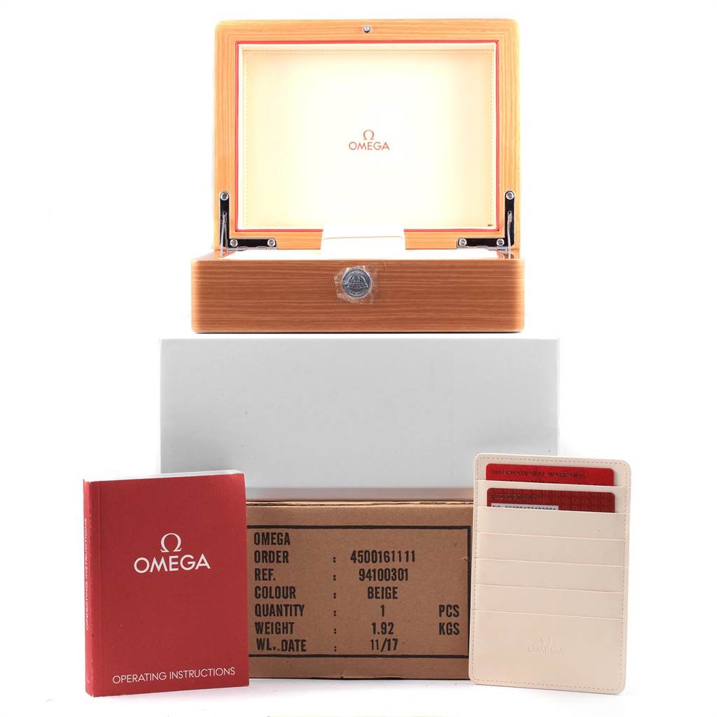 This image shows an Omega Planet Ocean 232.90.42.21.03.001 Men's Titanium Blue Dial 232.90.42.21.03.001 Men's Titanium Blue Dial watch box, operating instructions, and a certification card holder.