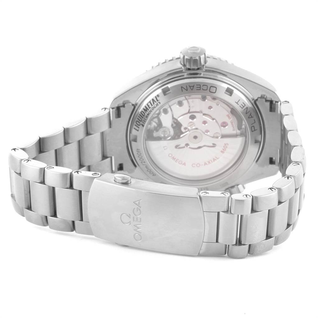 The image shows the back view of an Omega Planet Ocean 232.90.44.22.03.001 Men
s Titanium Blue Dial 232.90.44.22.03.001 Men
s Titanium Blue Dial watch, highlighting the transparent case back and the metal bracelet.