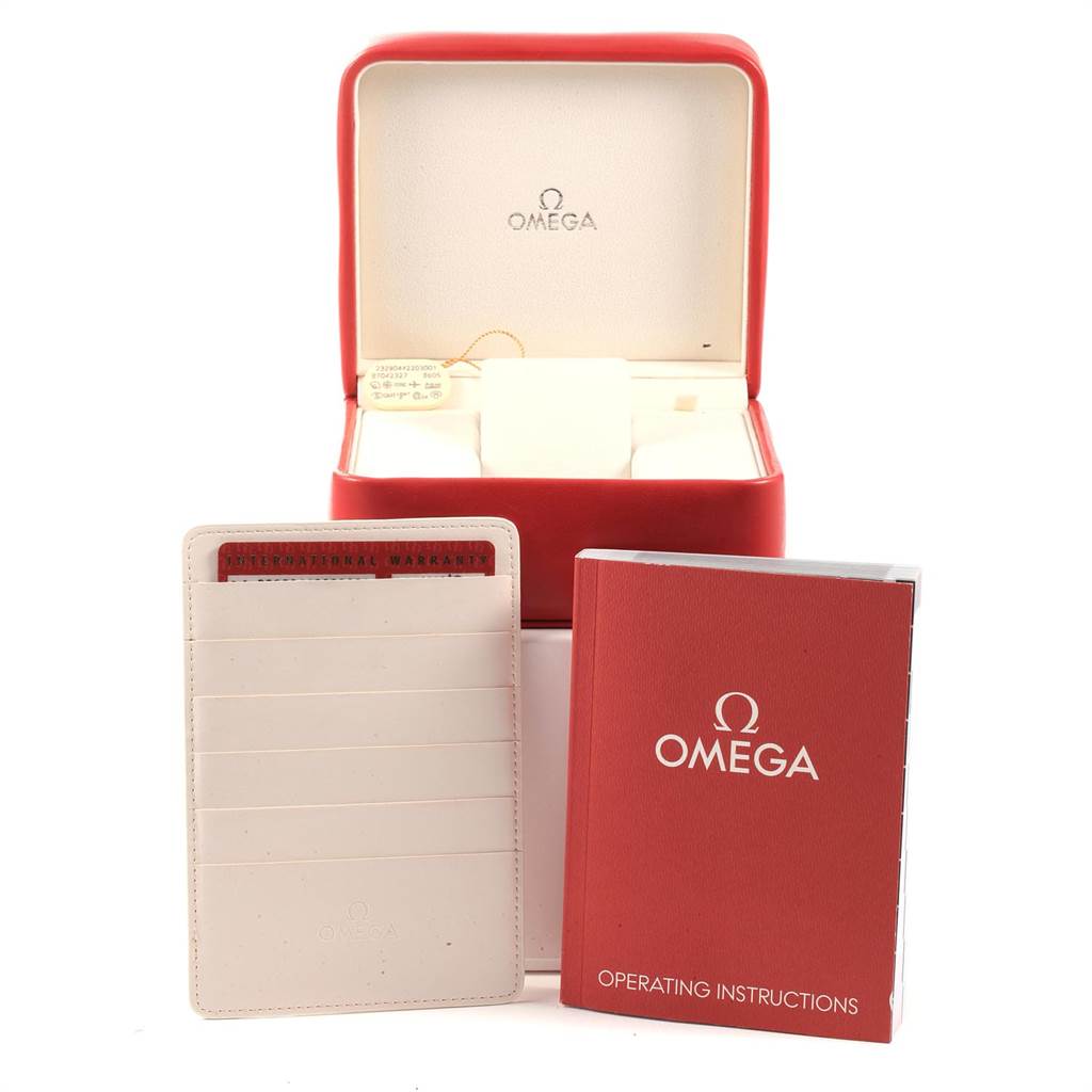 The image shows the box, warranty cardholder, and operating instructions for an Omega Planet Ocean 232.90.44.22.03.001 Men
s Titanium Blue Dial 232.90.44.22.03.001 Men
s Titanium Blue Dial watch.