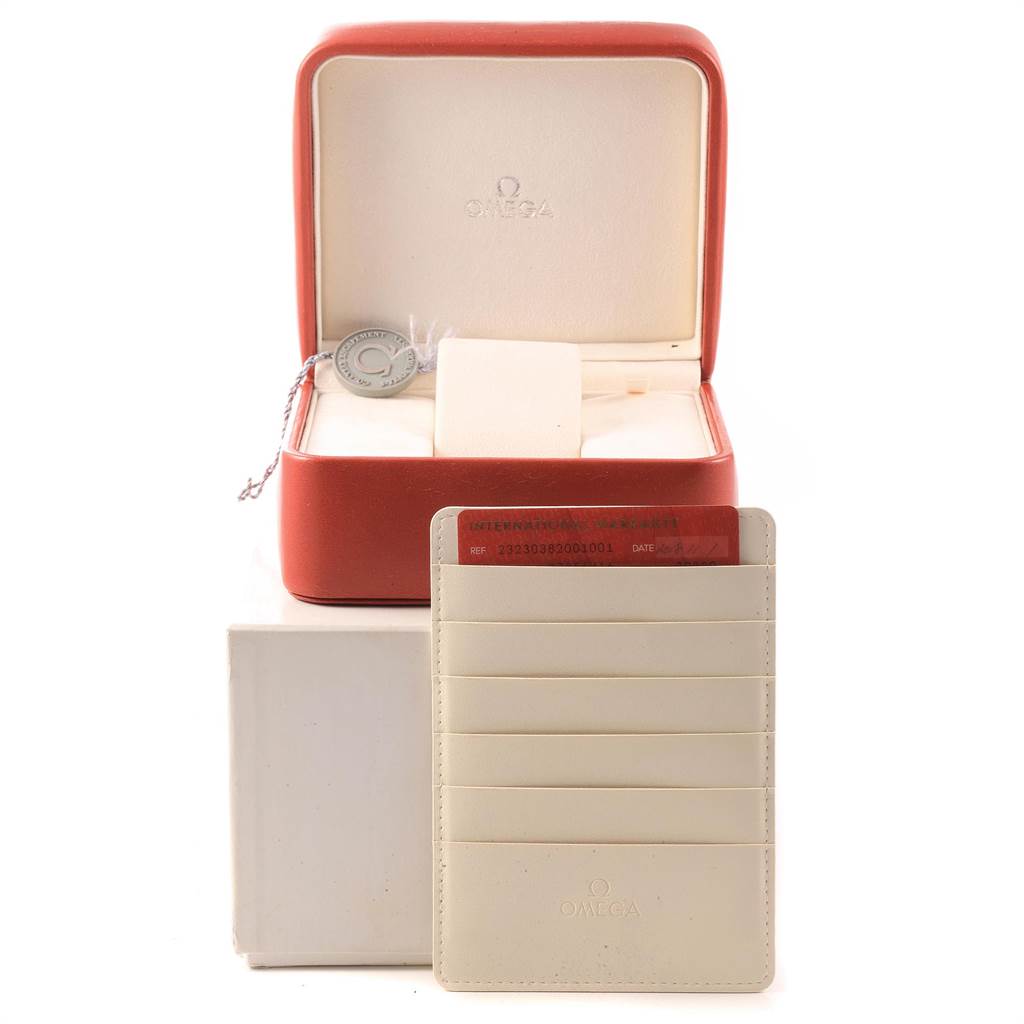 The image shows an Omega Planet Ocean 232.30.42.21.01.003 Men
s Stainless Steel Black Dial 232.30.42.21.01.003 Men
s Stainless Steel Black Dial watch box, a tag, and a white cardholder with cards, all from a frontal angle.